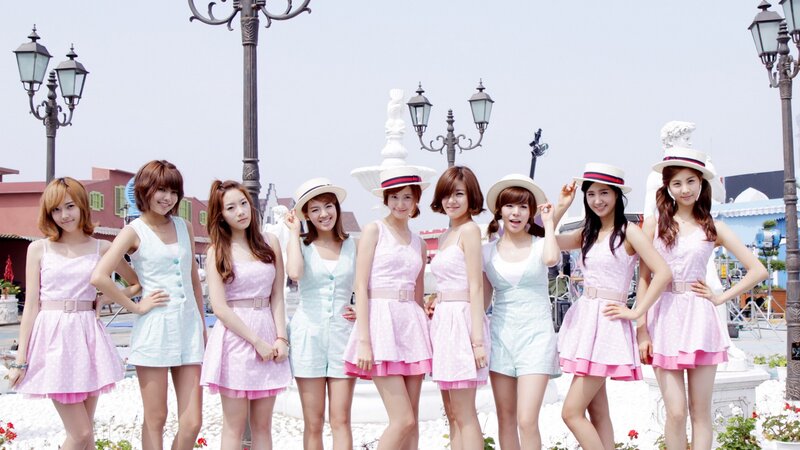 K-pop group in pastel outfits