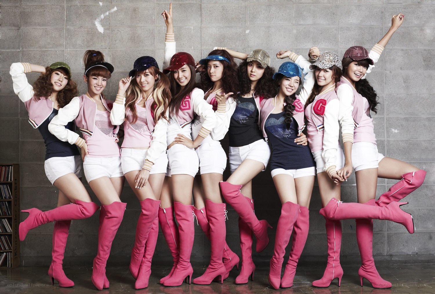 K-pop group in pink boots