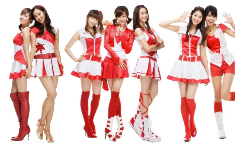 K-pop group in red and white outfits
