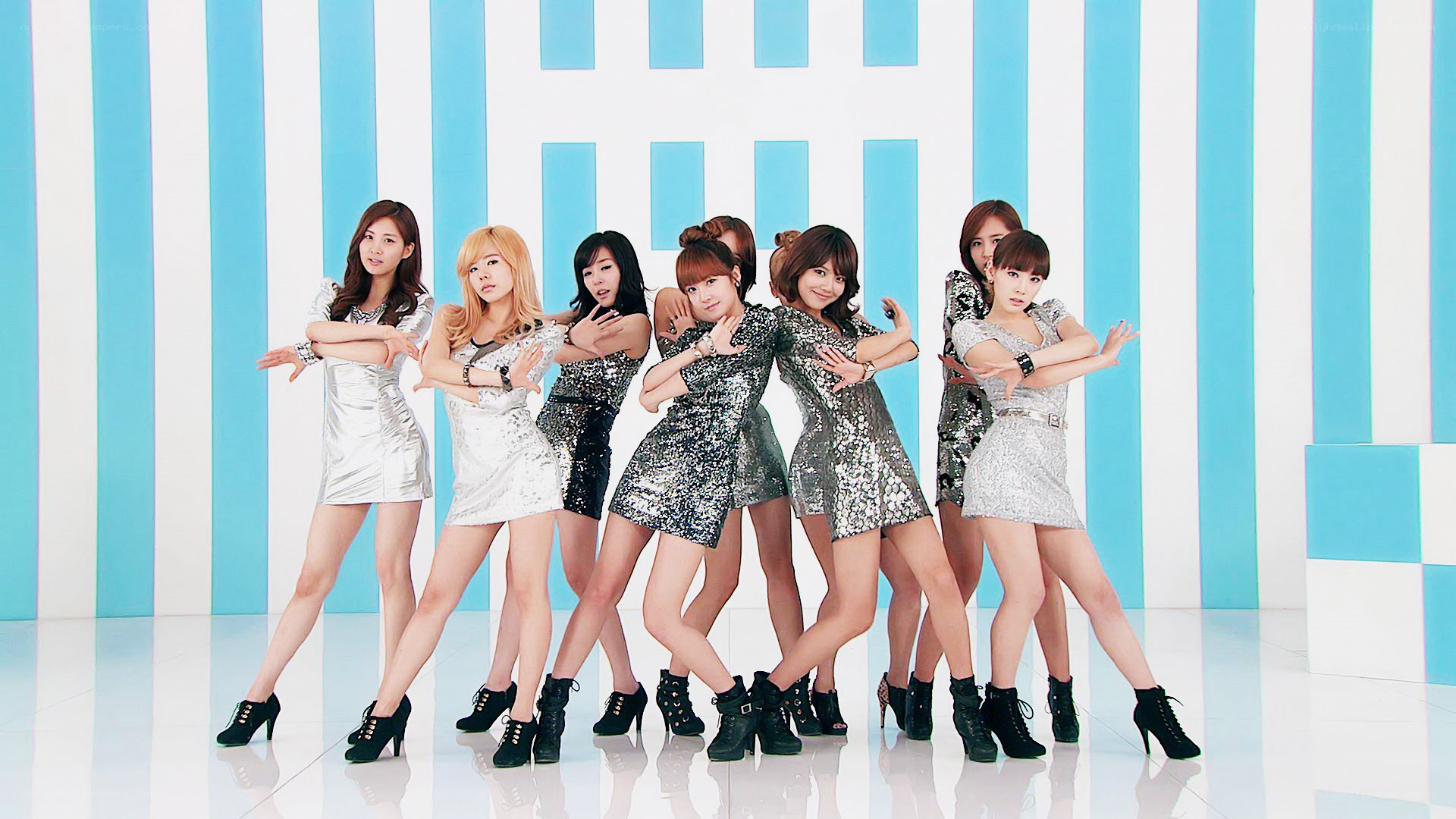 K-pop group in silver outfits