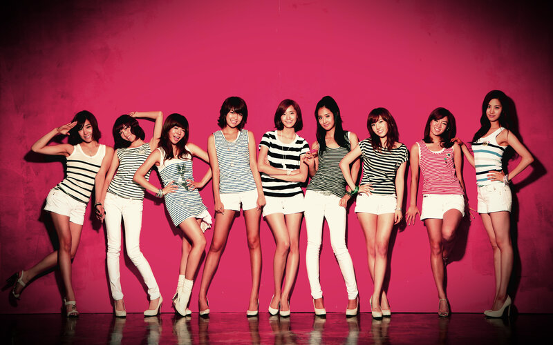 K-pop group in striped tops