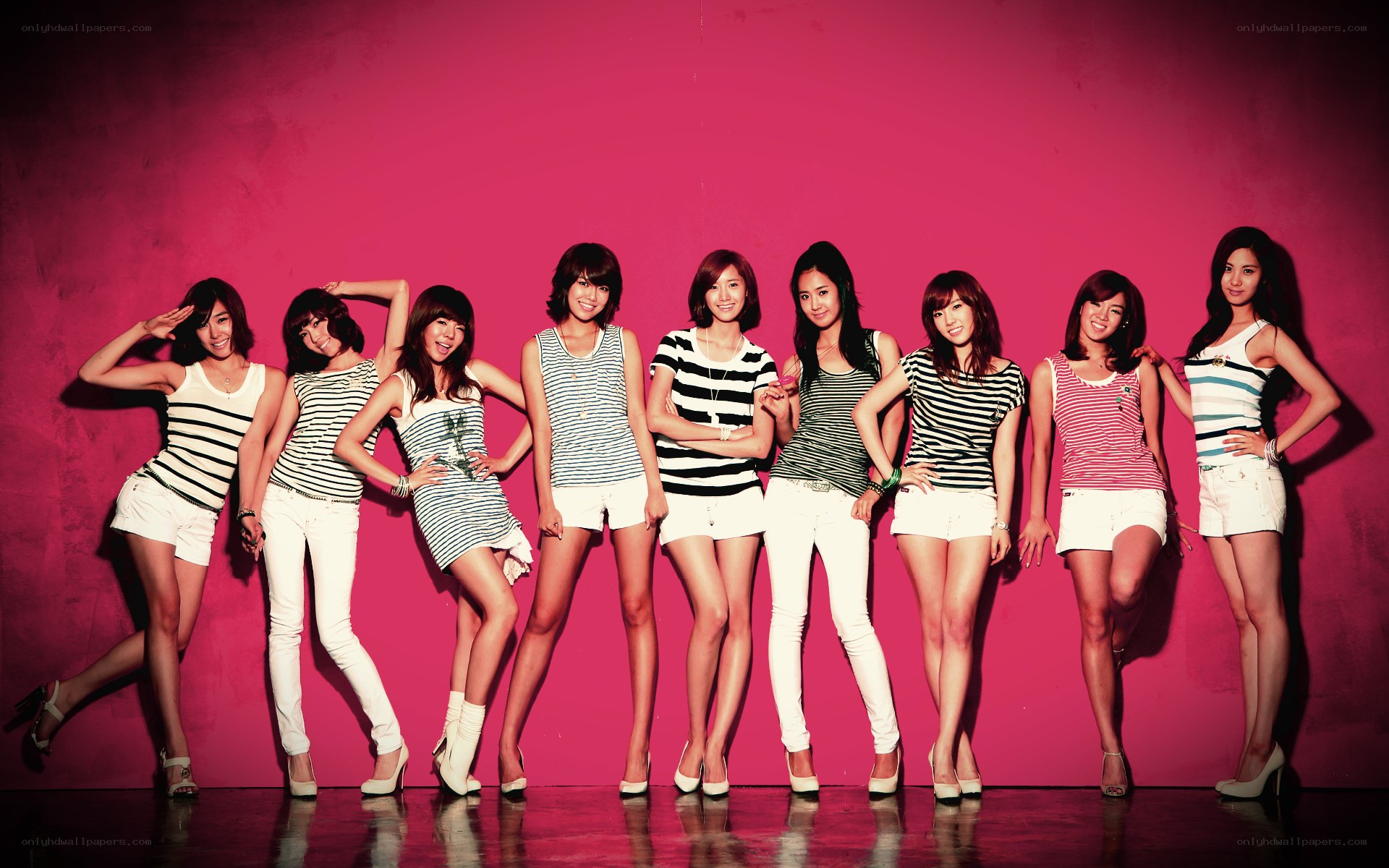 K-pop group in striped tops