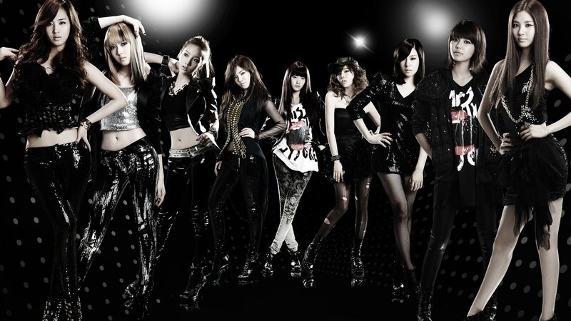 K-pop group in stylish outfits