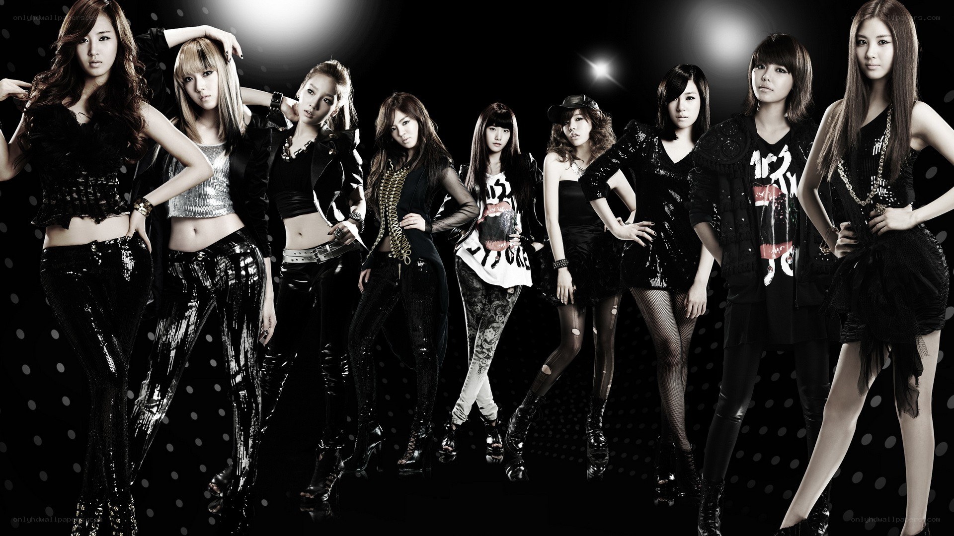 K-pop group in stylish outfits