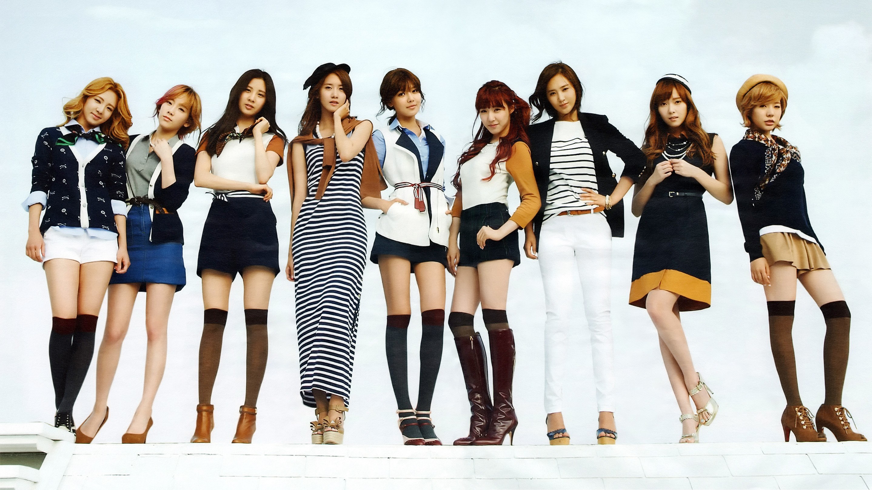 K-pop group in stylish outfits