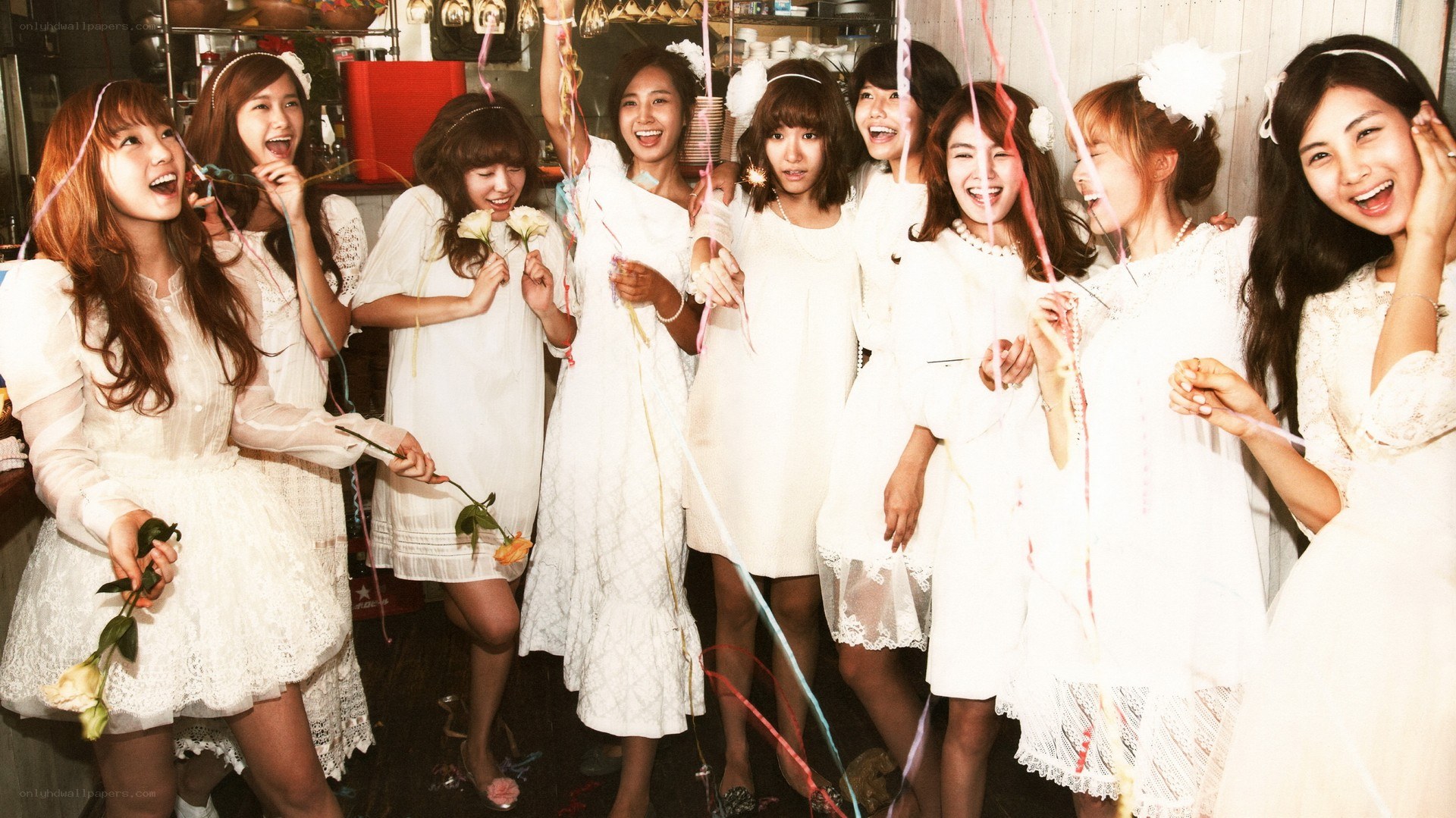 K-pop group in white dresses