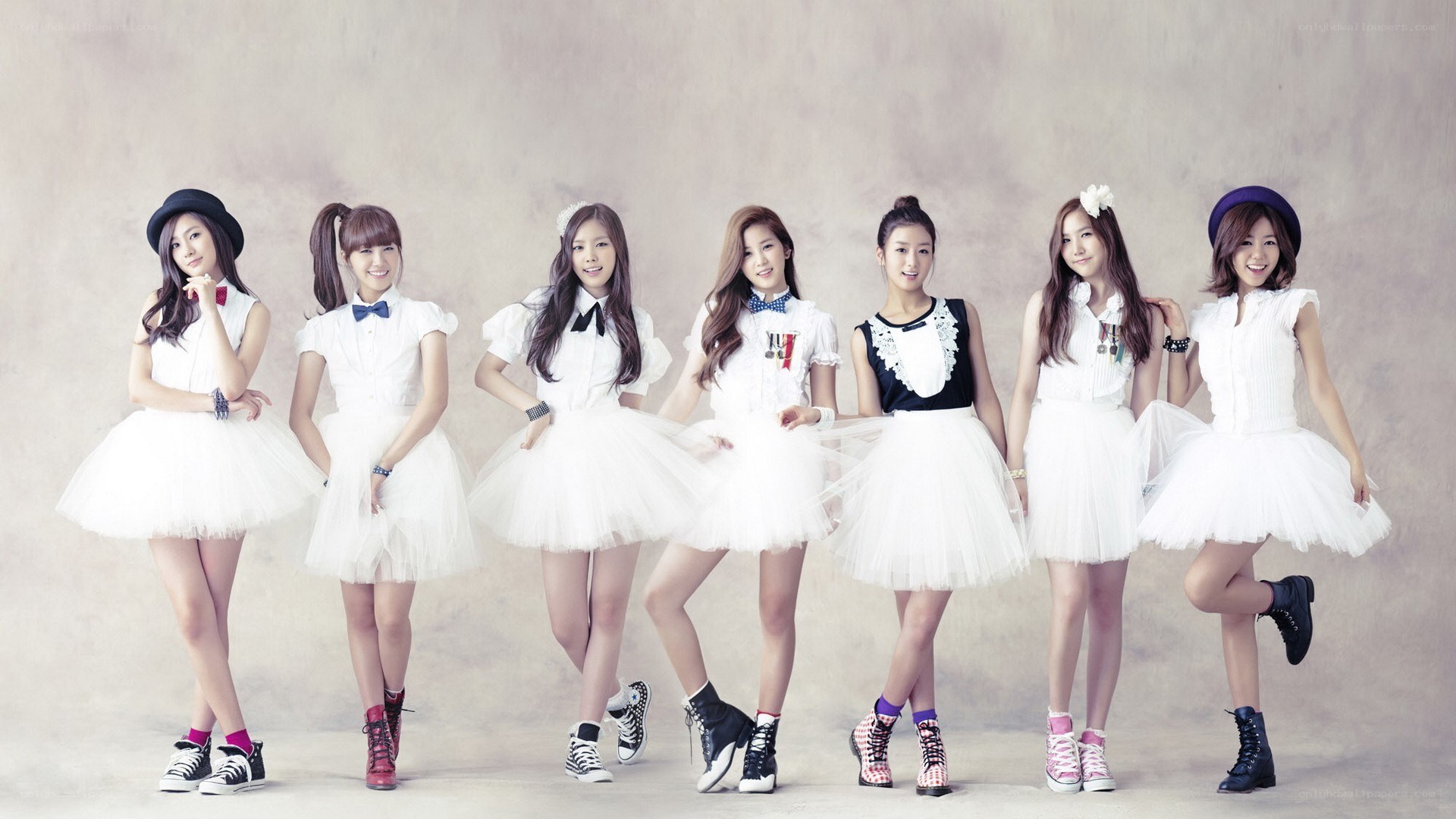 K-pop group in white dresses