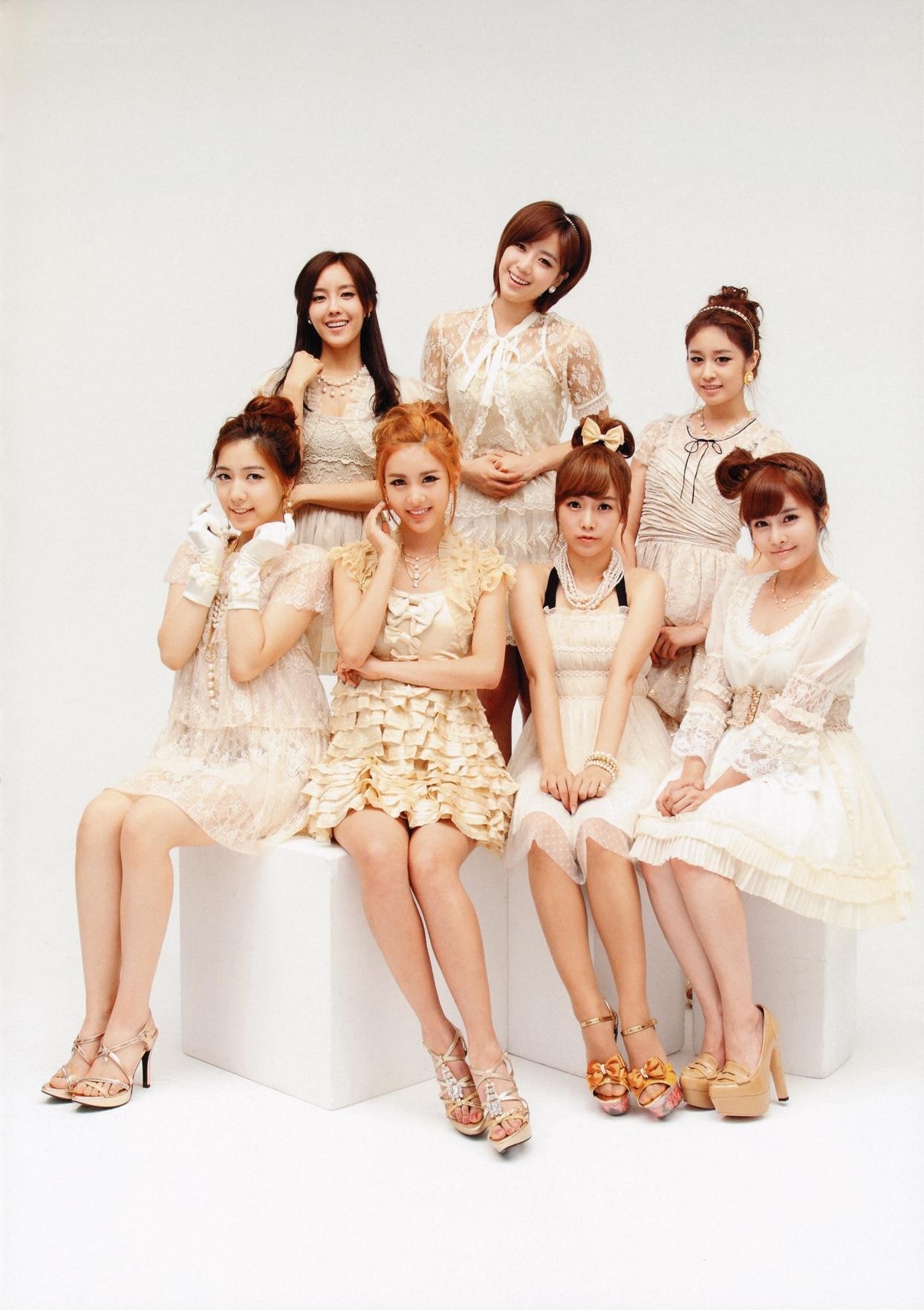 K-pop group in white dresses