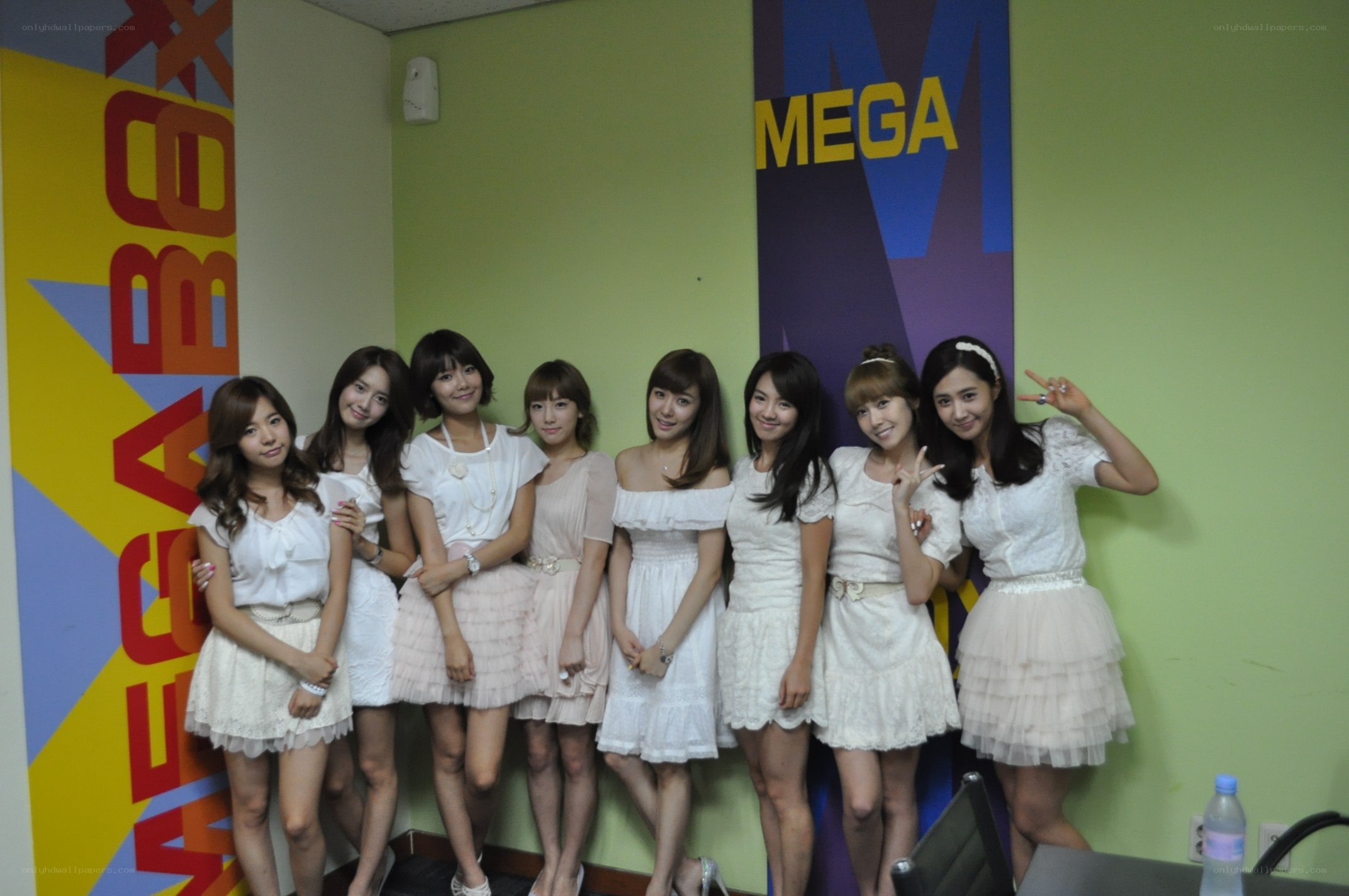 K-pop group in white dresses