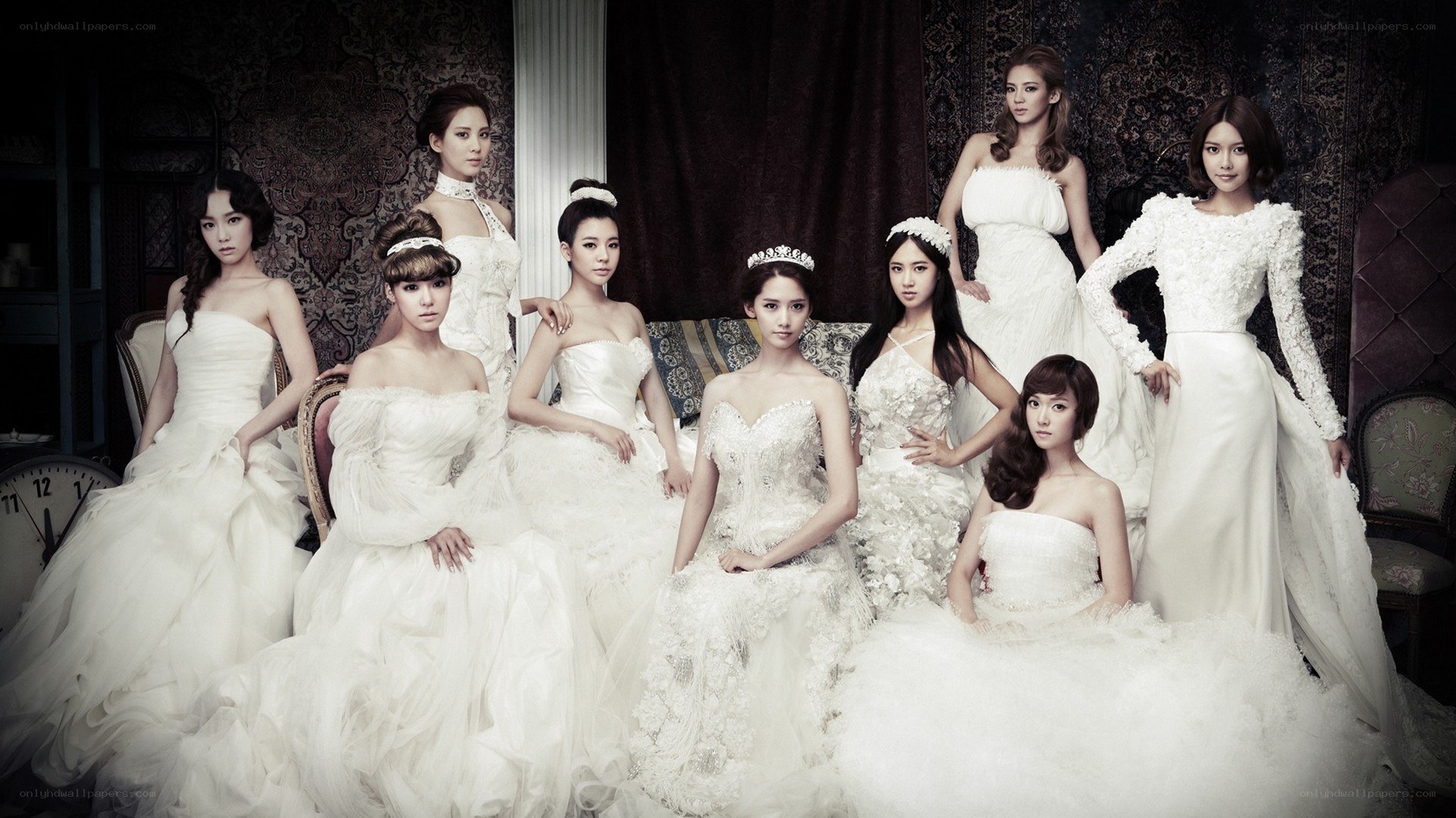 K-pop group in white gowns