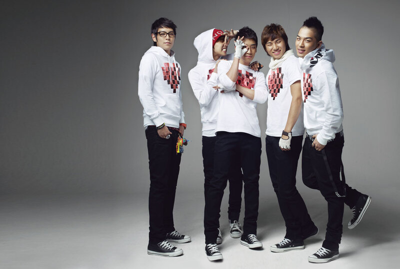 K-pop group in white hoodies
