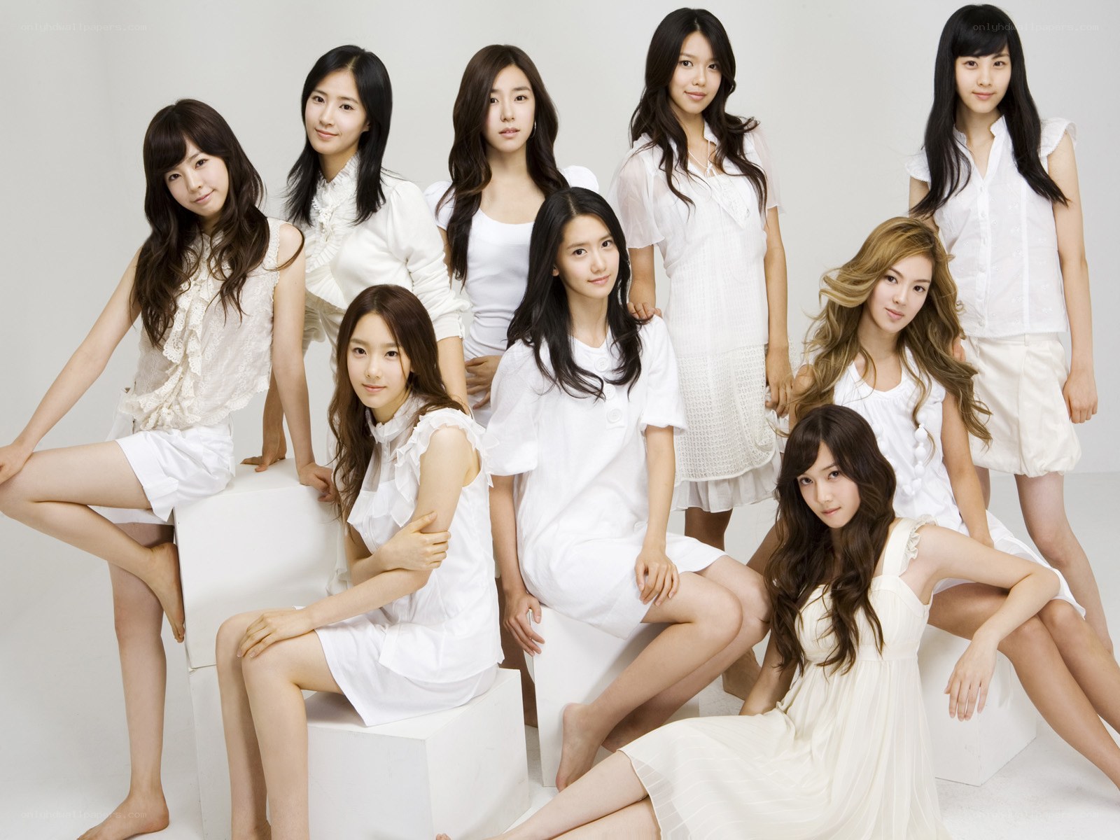 K-pop group in white outfits