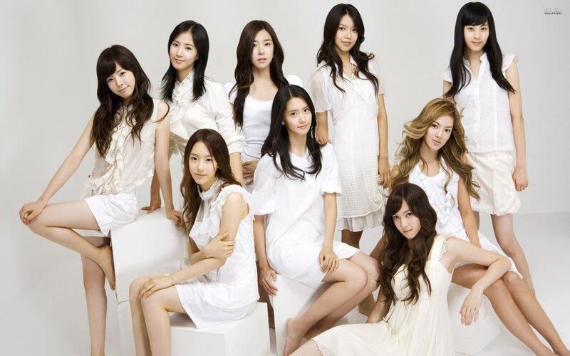 K-pop group in white outfits