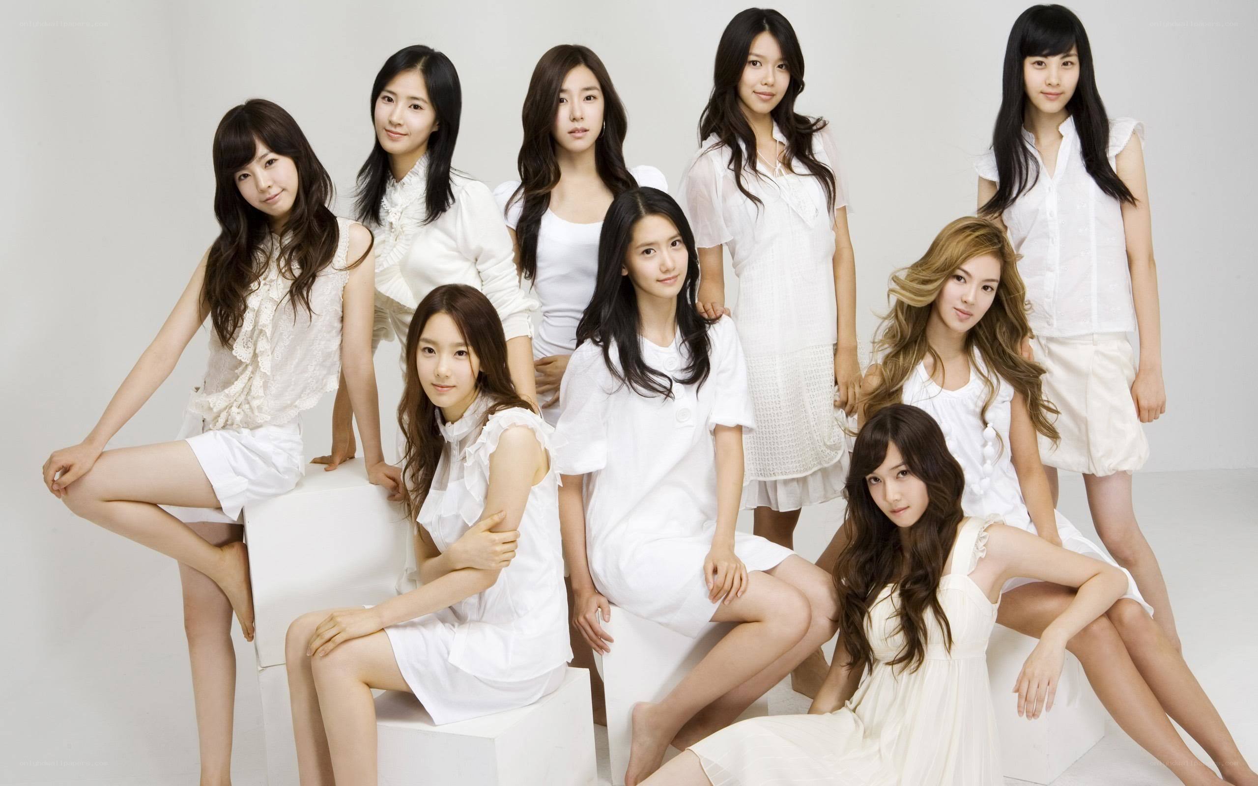 K-pop group in white outfits