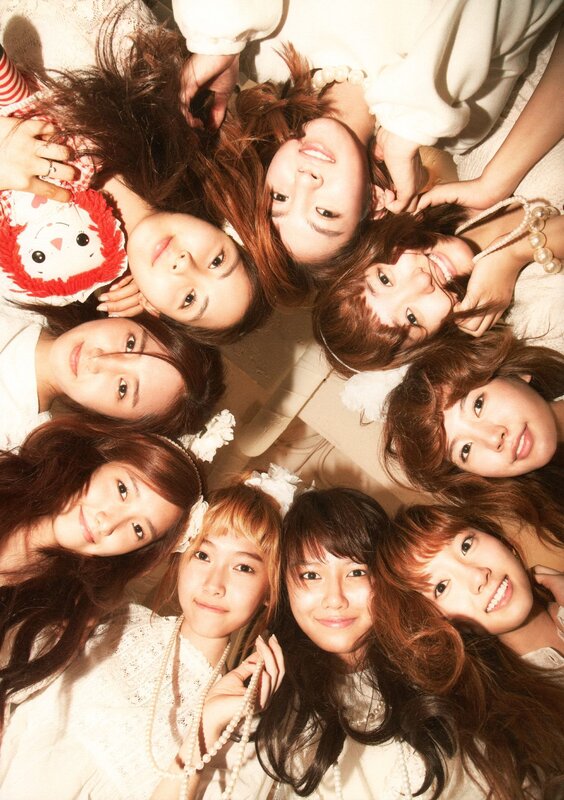 K-pop group in white outfits