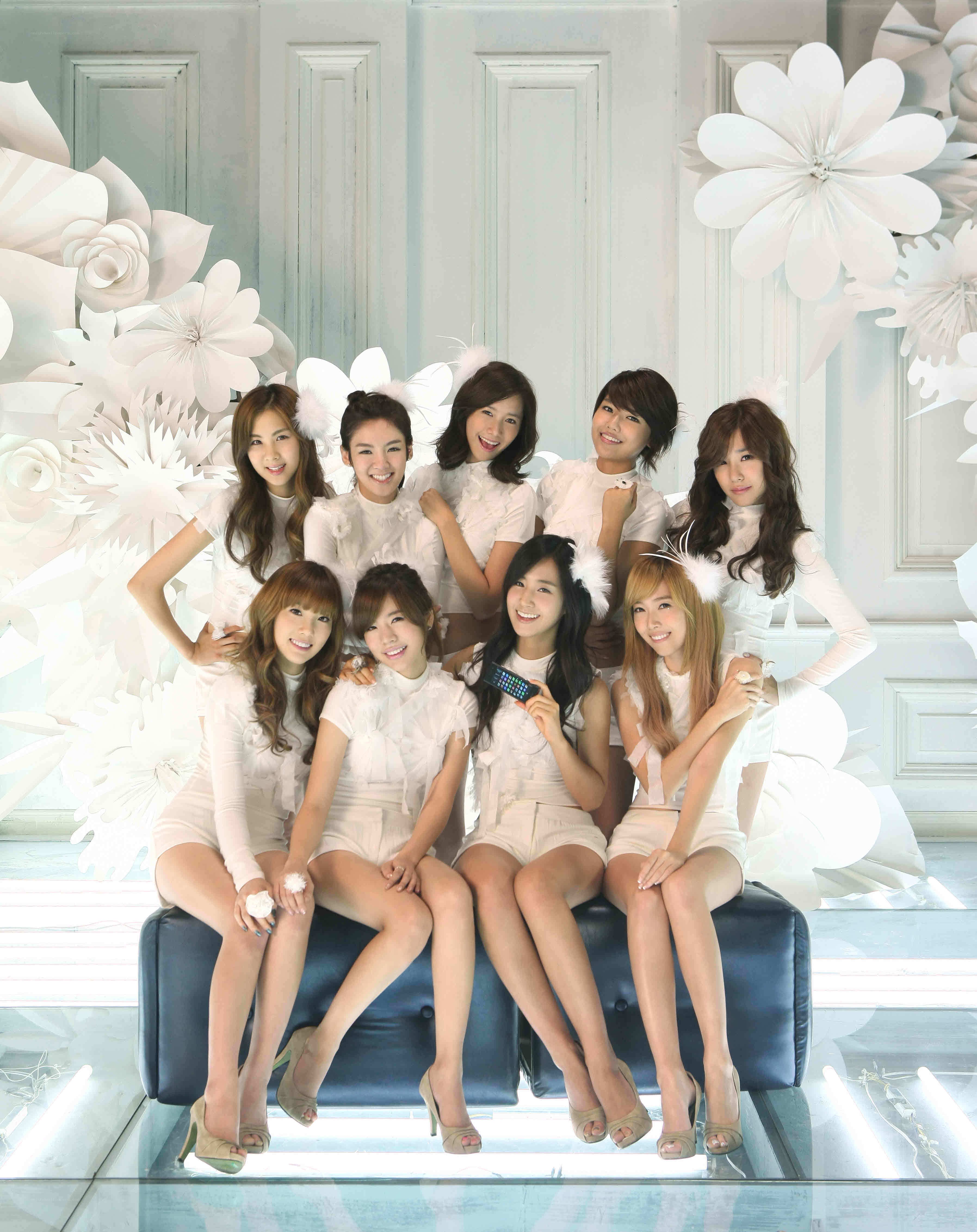 K-pop group in white outfits