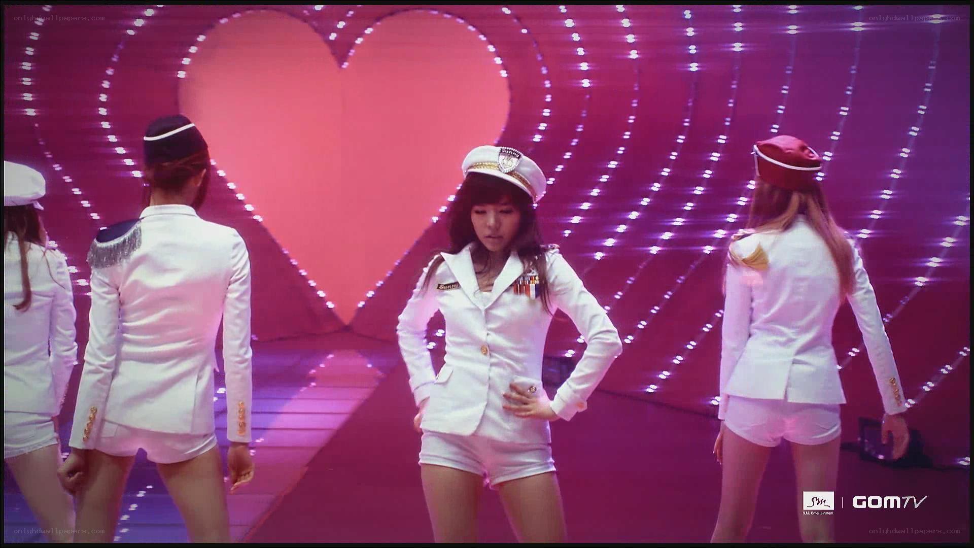 K-pop group in white uniforms