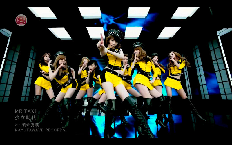 K-pop group in yellow outfits