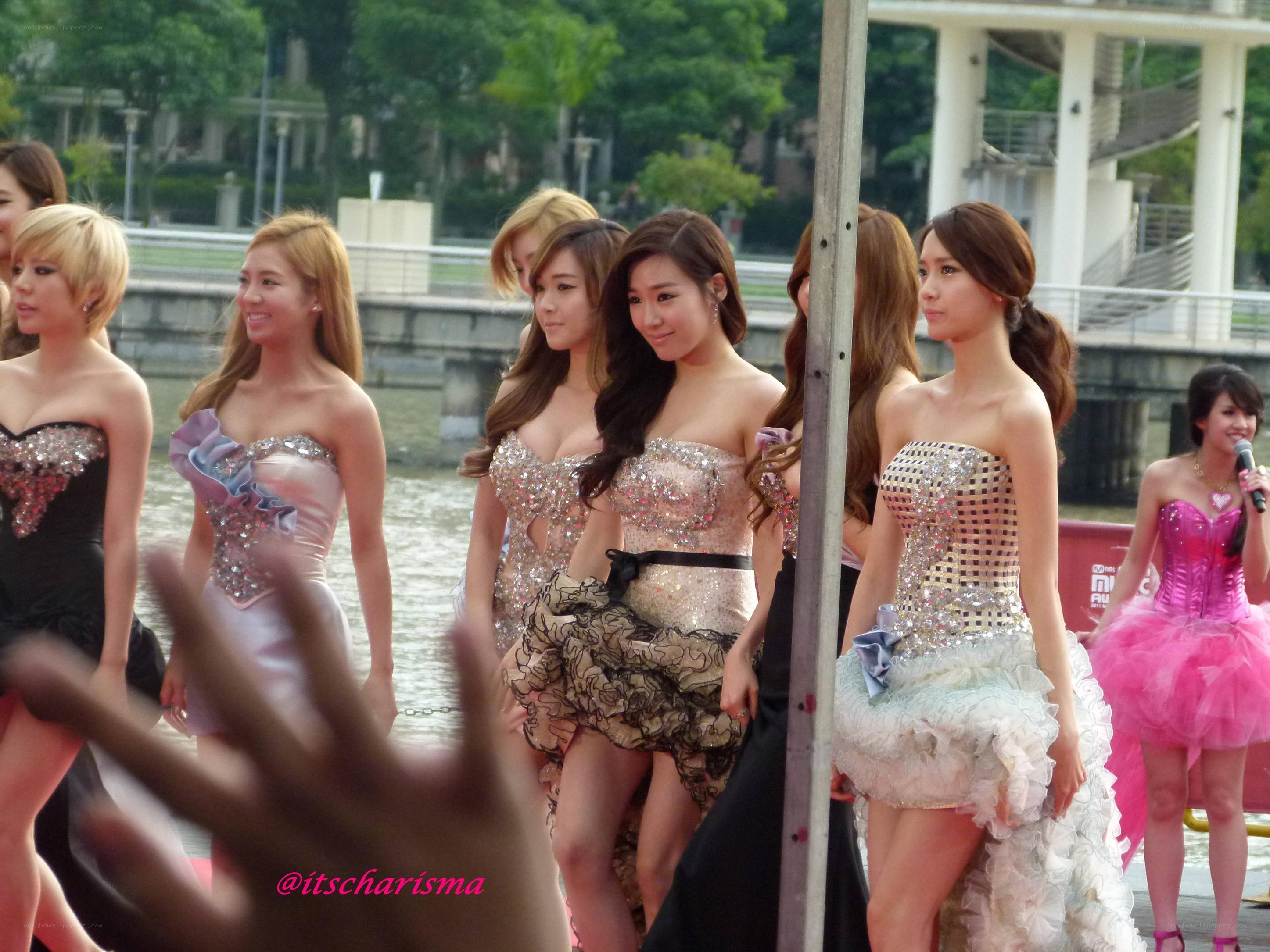 K-pop group on stage by water
