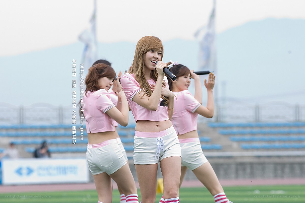 K-pop group performing on field