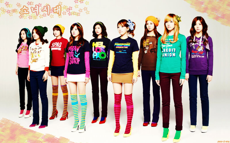 K-pop group photo with colorful outfits