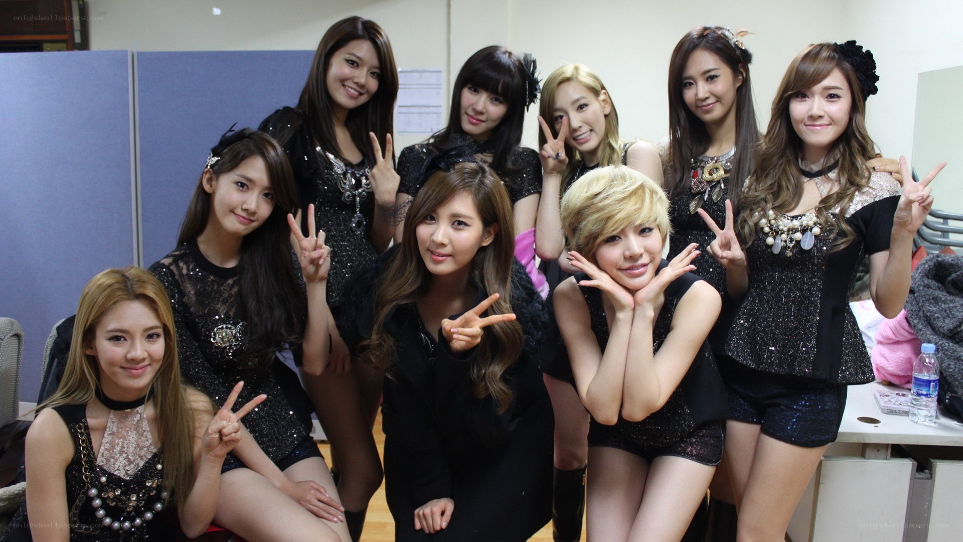 K-pop group posing backstage