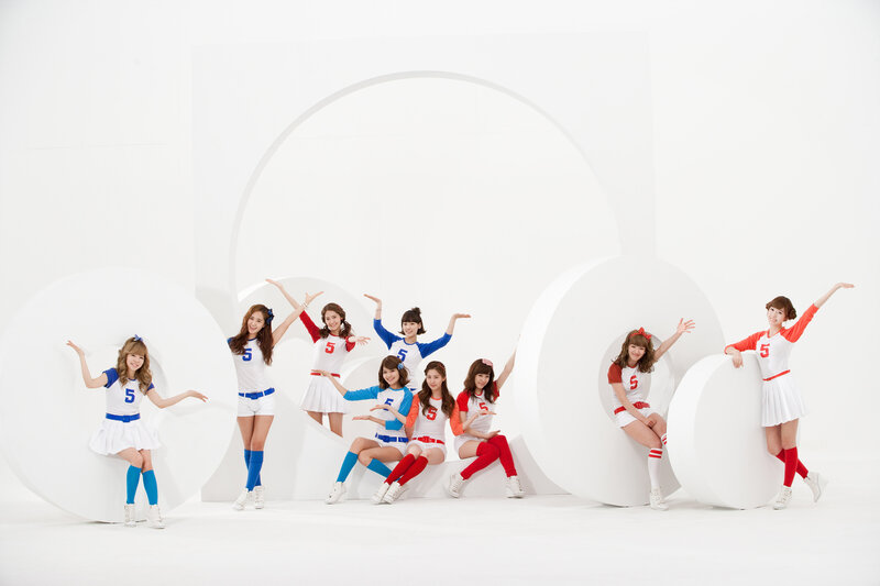 K-pop group posing in studio
