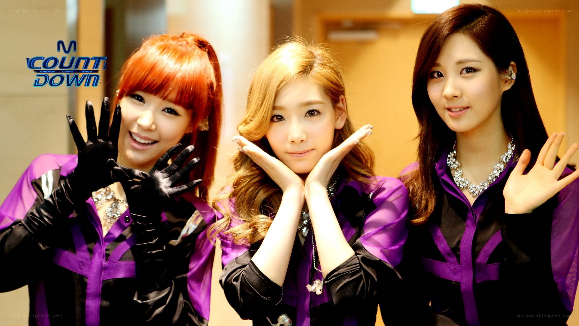 K-pop group posing on stage
