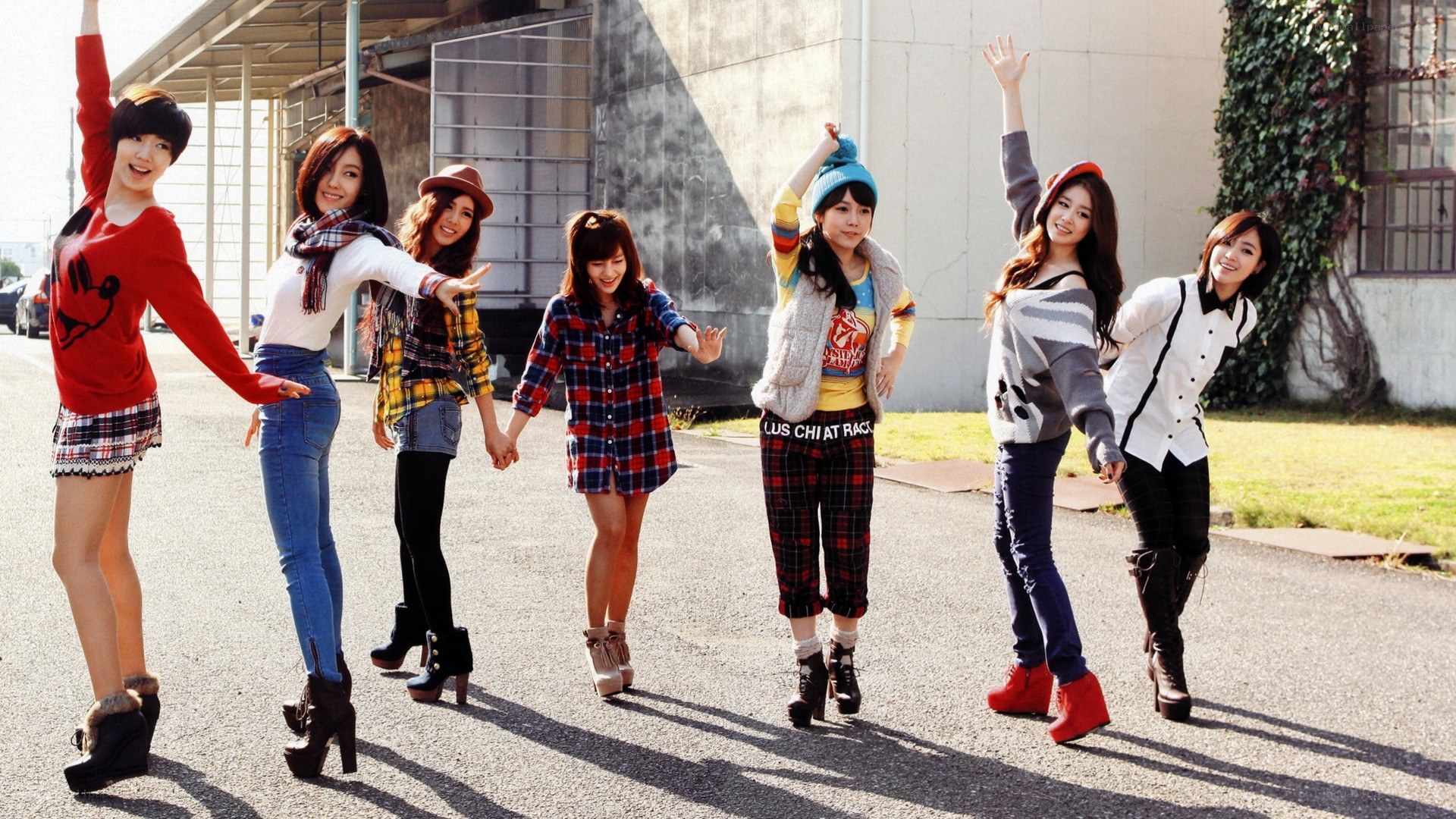 K-pop group posing outdoors