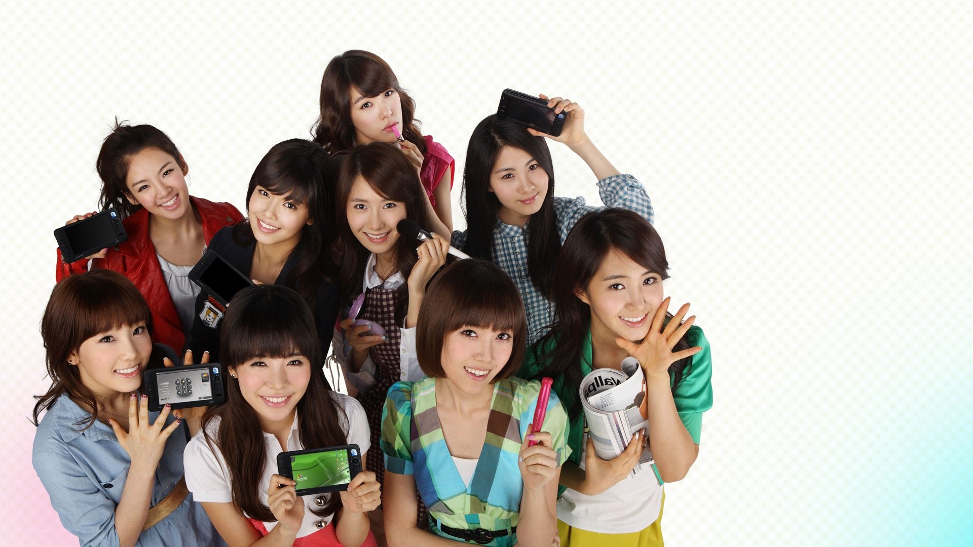 K-pop group posing with phones