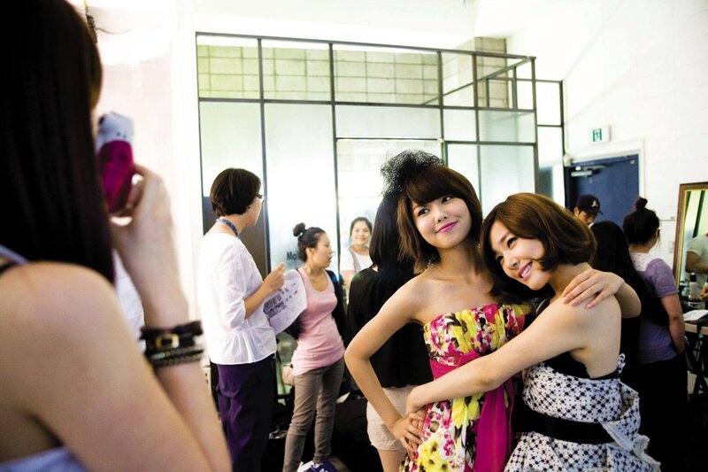 K-pop idols backstage at a photoshoot