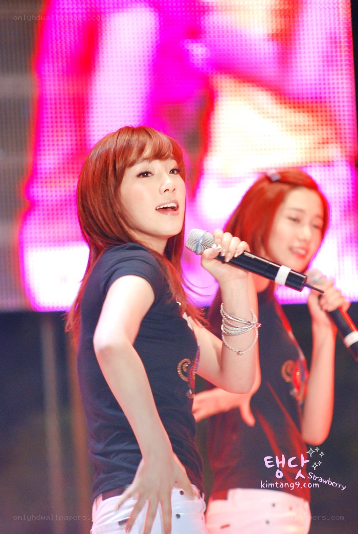 K-pop performers singing on stage
