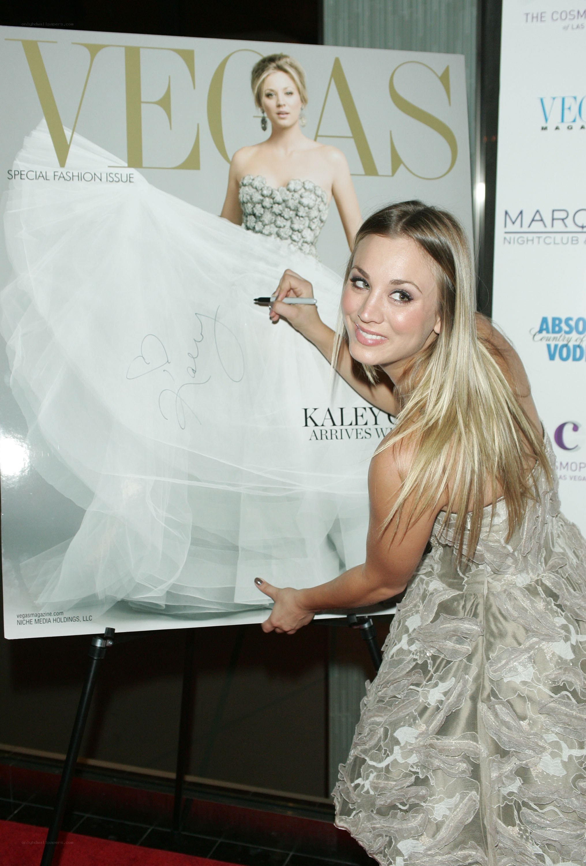 Kaley Cuoco signs magazine cover