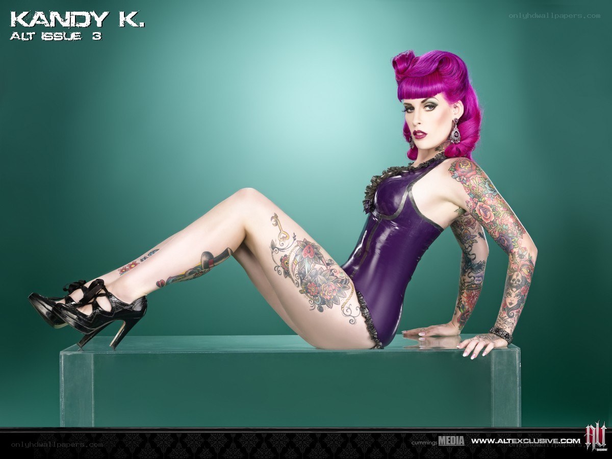 Kandy K in purple bodysuit