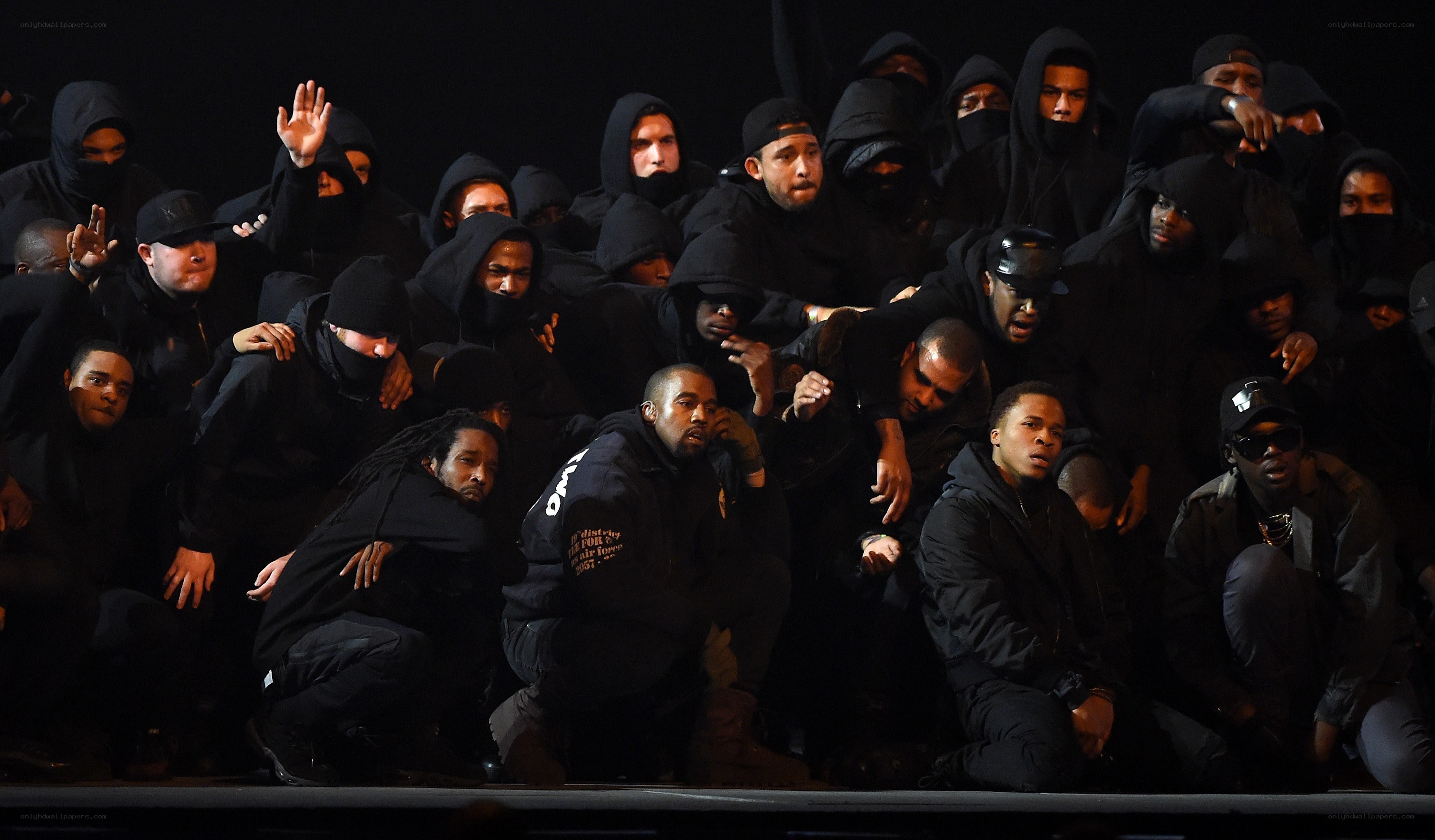 Kanye West and performers on stage
