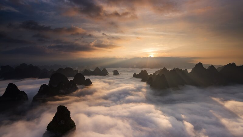 Karst Mountains Above Clouds — Orange