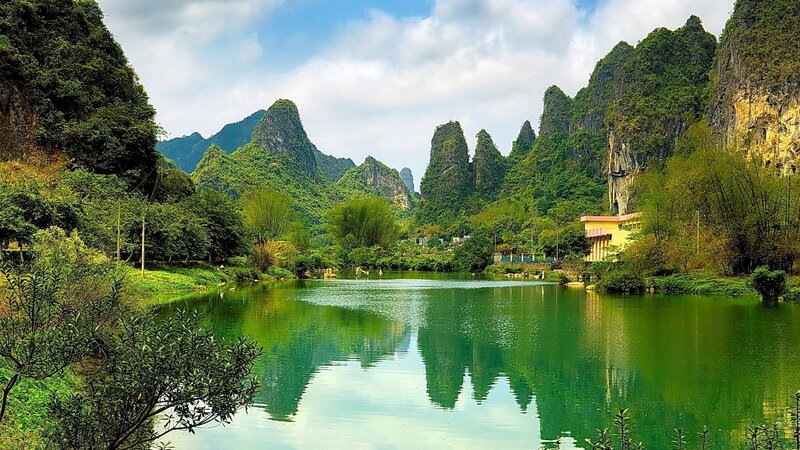 Karst Mountains and Lake — Green, Serene, Afternoon, Photograph, Building