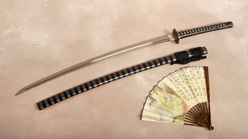 Katana and fan on display