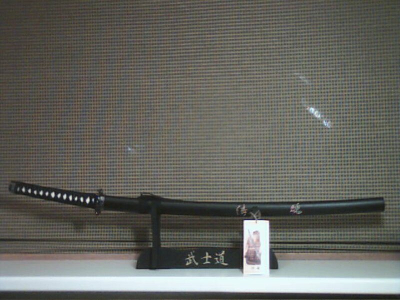 Katana on Display Stand — Black, Neutral, Photograph, Sword, Tag