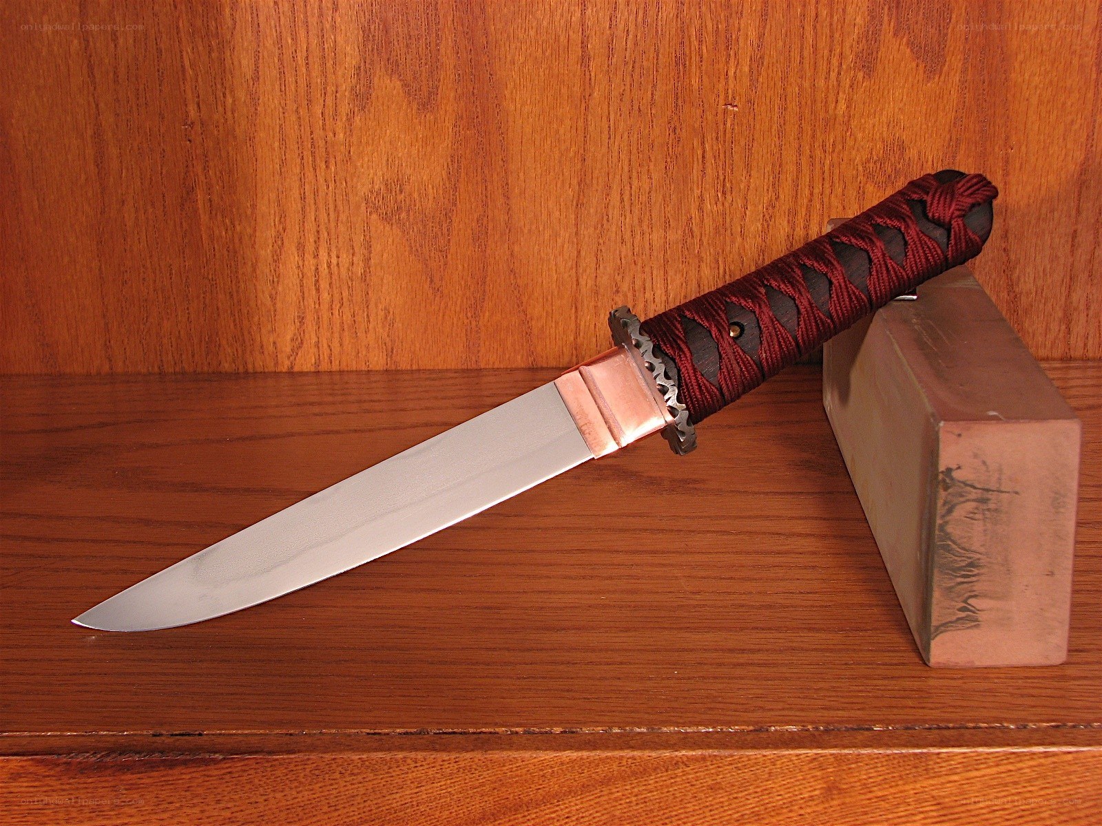 katana with red-wrapped handle