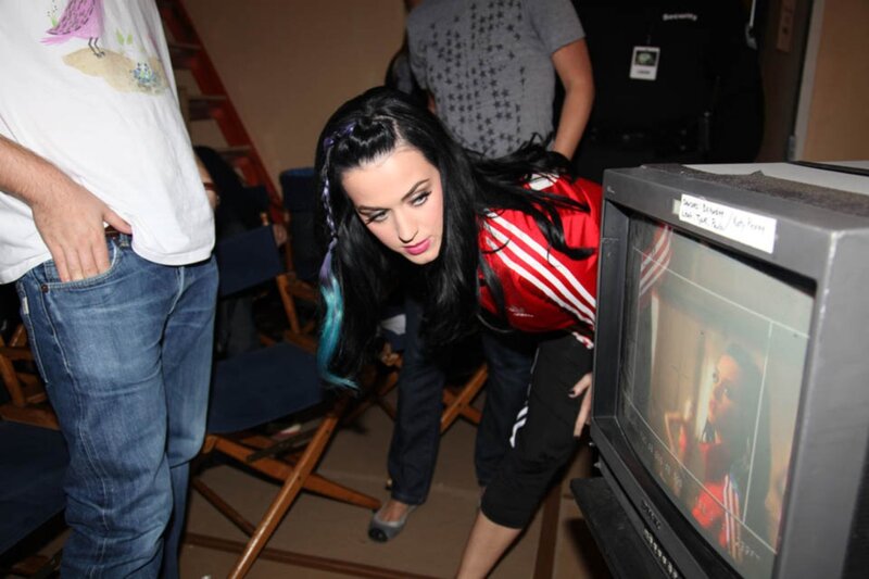 Katy Perry on set watching monitor
