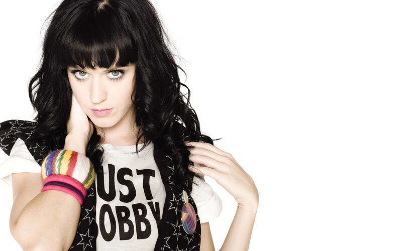 Katy Perry posing with colorful bracelets