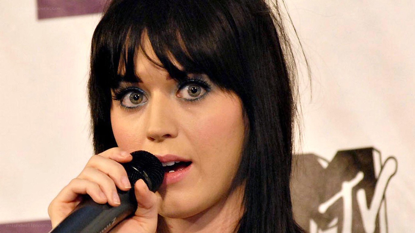 Katy Perry singing into a microphone