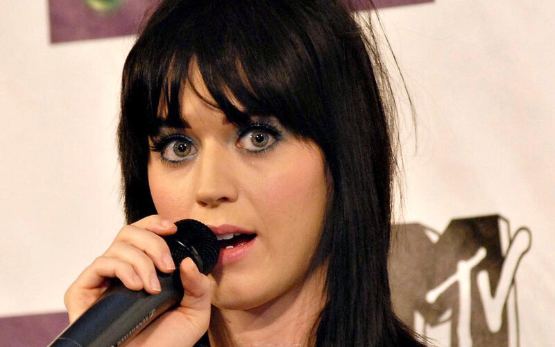 Katy Perry speaking into microphone