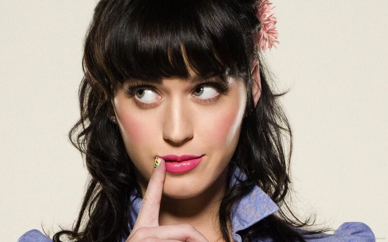 Katy Perry with finger to lips