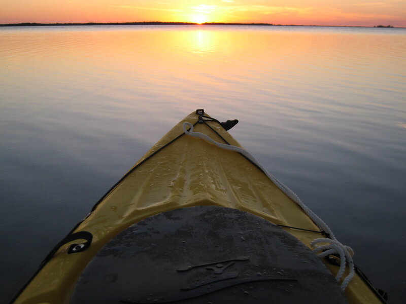 kayak at sunset on calm water
