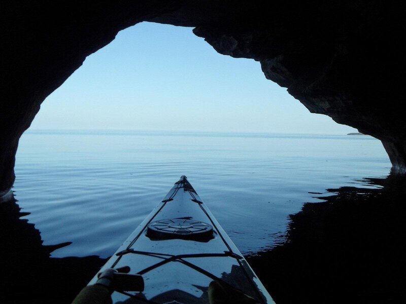 Kayak in Cave Opening