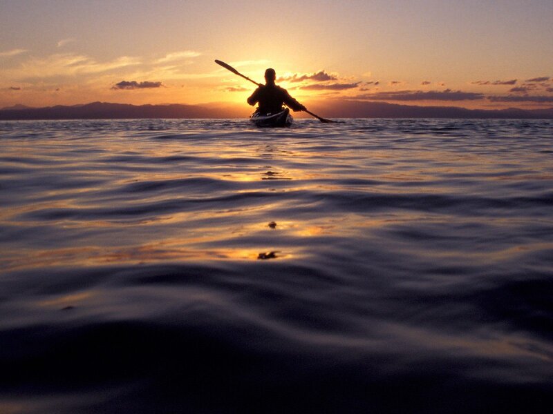 kayaker at sunset
