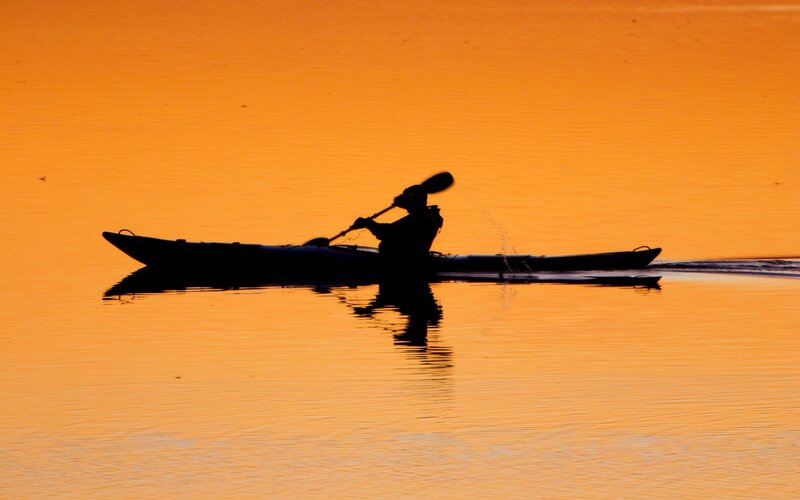 kayaker at sunset