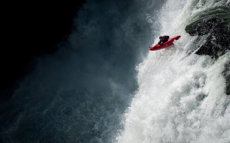 Kayaker Descending Waterfall — Red